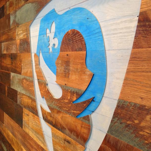 Settlers' Plank Mixed Oak wall paneling, cut with a CNC of the credit union's logo done by our sister company NEWwoodworks