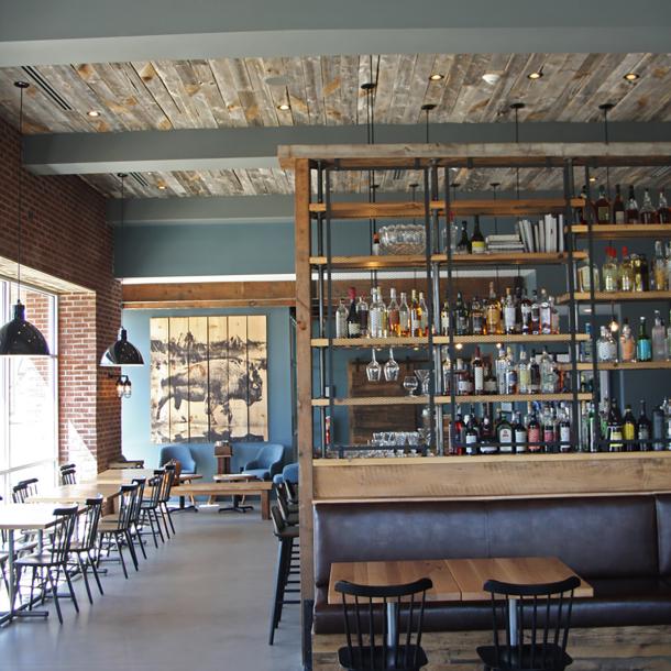 Reclaimed softwoods t&g ceiling joins other reclaimed wood tables, fixtures, cabinetry, doors, and more in Kindred Fare.