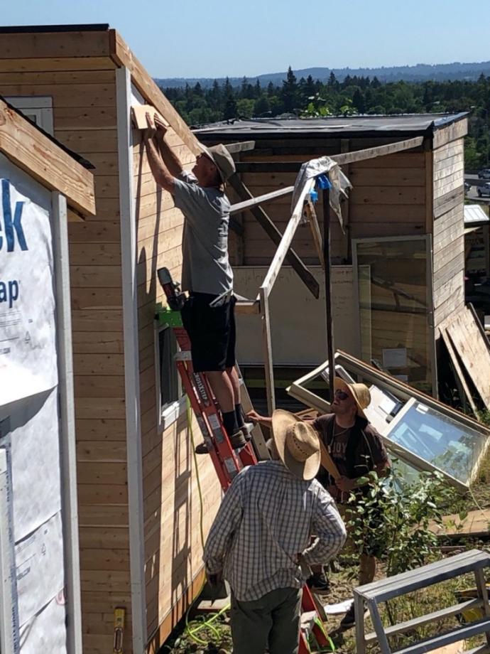 Installation of Pioneer Millworks Exterior Select Larch Siding at the Agape Village in Oregon.