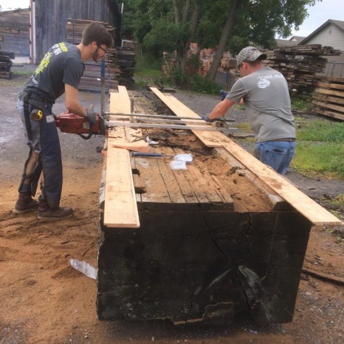 An Alaskan Mill, or chainsaw mill, is required to resaw the large timbers.